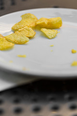 Chip snack potatoes served on a white plate