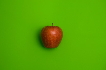 an apple on a green background