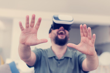 man with beard trying vr glasses