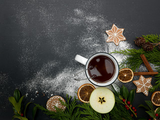 christmas background with tea or punch and cookies, oranges and other christmas items