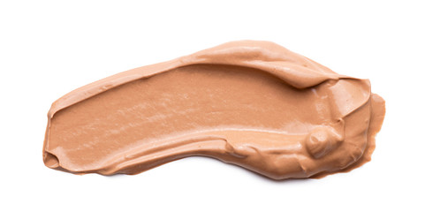 Close-up of liquid cosmetic foundation smudge bb cream isolated on white background