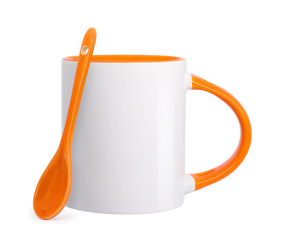 Ceramic mug and spoon isolated on white background. Template of blank drink cup for your design. Clipping paths object.