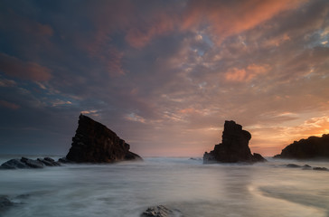 Sea sunrise, near the rocks