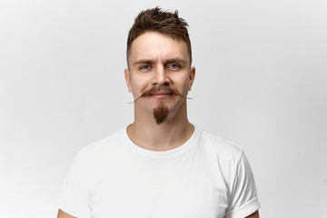 People, style, hairdressing and fashion concept. Isolated shot of happy cheerful young European...