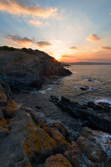 Sea sunrise, near the rocks