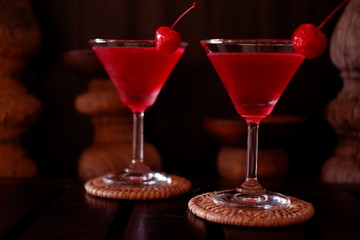 martini cocktail on wood table and water splash