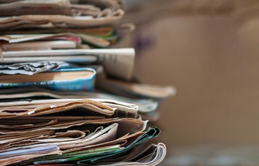 Pile of old newspapers and magazines. With copy space