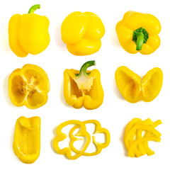 Set of fresh whole and sliced yellow bell pepper isolated on white background. Top view