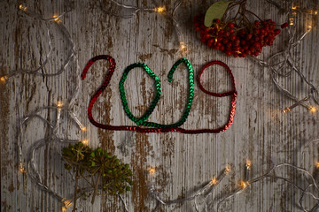 new year 2019 written with red and green sequin ribbons