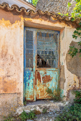 Very old grungy iron weathered door.