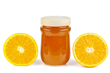 Homemade orange jam in glass jar isolated on white background