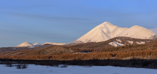 Winter landscape of Mongolia. Hill on a background