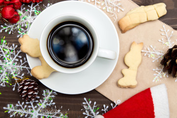 Cup of coffee with cookies and Christmas decorations. Christmas template. Selective focus