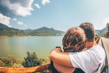 Fototapeta premium Couple in love happily walks in the background