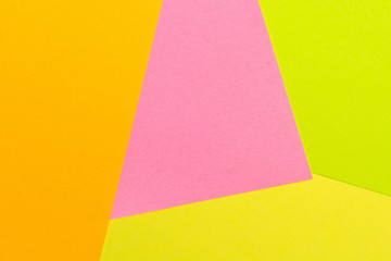 Yellow, pink, orange and green color texture paper background. Geometric paper background, pastel colors .