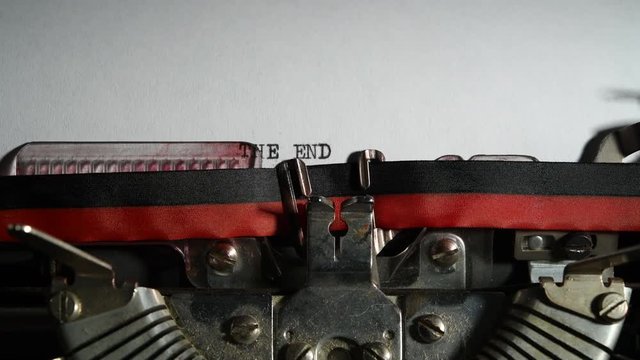 Typewriter vintage writing text "The end" close up