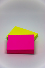 Green and pink Sticky note paper on white background.