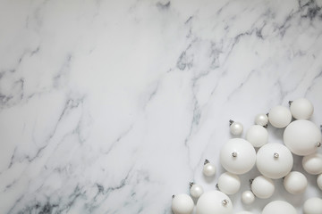 Christmas composition. white festive ball decorations on a marble background