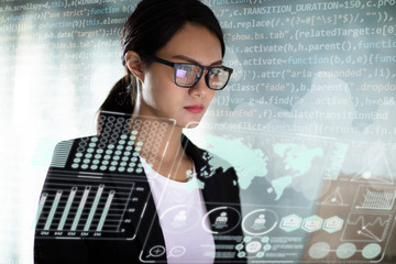 young business woman working in office with laptop - Powered by Adobe