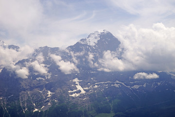 Naklejka premium Alpine peaks of Grindelwald and Jungfrau. Landskape background of Bernese highland. Alps, tourism, journey, hiking concept.