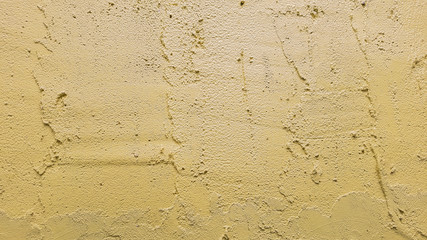 A yellow cement and concrete texture for pattern abstract background.