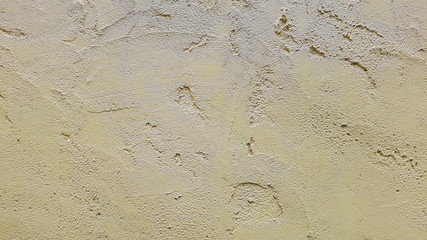 A yellow cement and concrete texture for pattern abstract background.