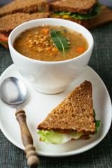 Lentil soup with sandwiches.