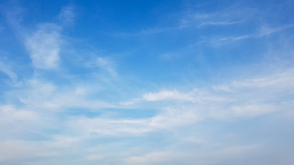 Deep blue sky and white cloud background.