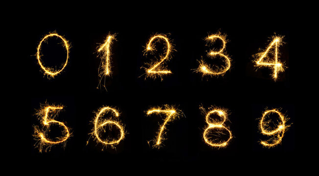 Set Of Burning Sparkler Numbers Isolated On Black Background