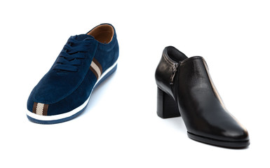 blue shoe for husband and black one for wife on white as filiation concept