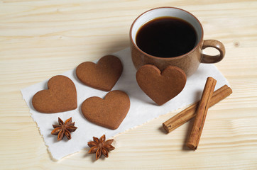 Coffee, heart shaped ginger cookies and spice