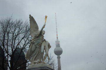 View to Berlin television tower from Palace bridge with angel statue © lavinak
