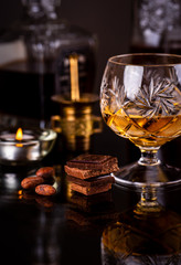 Chocolate with alcohol on dark background