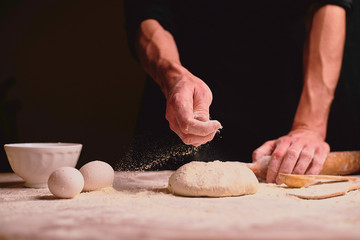 Obraz premium hands kneading dough