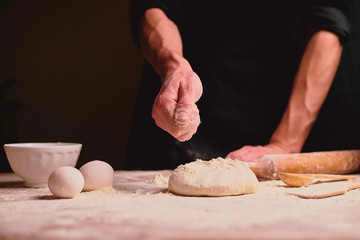 hands kneading dough