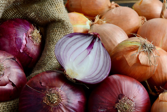 Red and yellow onions with wooden floor.
Know Which Onions to use For Which Preparations.
 Red onions are great for sandwiches and salads that are full of strong flavors.