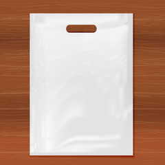Quality Plastic Bag on wooden background,white plastic bag.Realistic Shopping Bag for branding and corporate identity design.Vector set mock up.