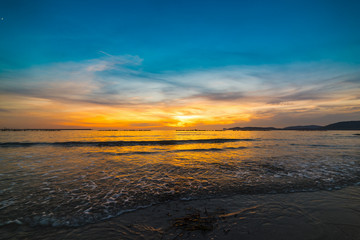 Blue and orange sky over the sea in Alghero at sunset