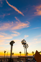 Santa Monica beach under a colorful sky at sunset