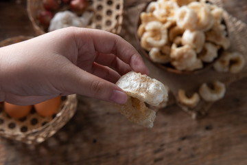 Pork rinds also known as chicharon or chicharrones , kab moo