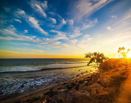 Malibu Beach Under A Colorful Sky At Sunset