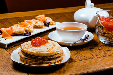 Stack of traditional russian pancakes blini. Russian food, russian kitchen