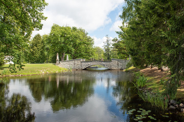 Fototapeta na wymiar old stone bridge over river