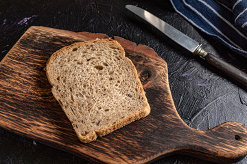 Slice of bread on a chopping board.
