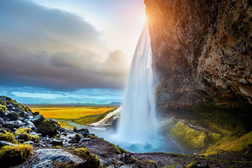 Fototapeta na wymiar Seljalandsfoss waterfall during the sunset, Beautiful waterfall in Iceland.