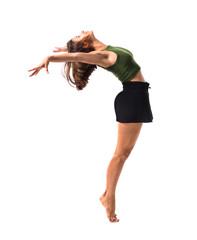 Young girl dancing and jumping in studio on isolated background