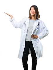 Doctor woman with stethoscope holding copyspace imaginary on the palm to insert an ad on isolated...