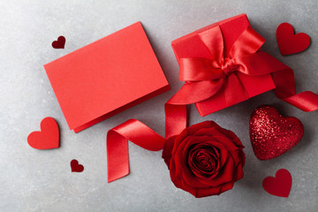 Gift box, rose flower, empty note and hearts for Valentines day card.
