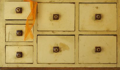 Vintage drawer with decorative ribbons