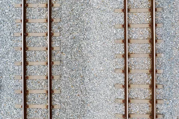 Foto op Aluminium Treinspoor Bovenaanzicht van spoorlijnen en abstracte achtergrond